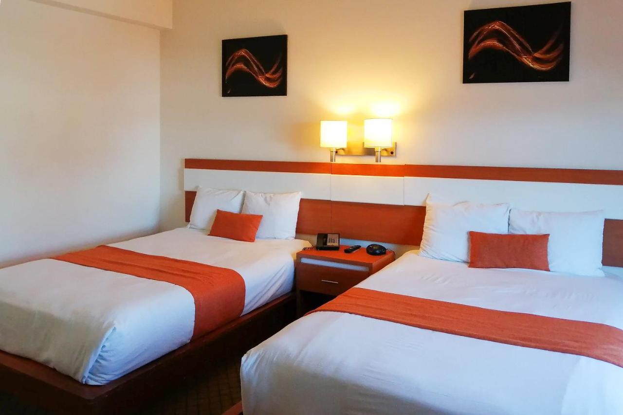 Capital O Hotel Herederos, Пьедрас-Неграс Экстерьер фото