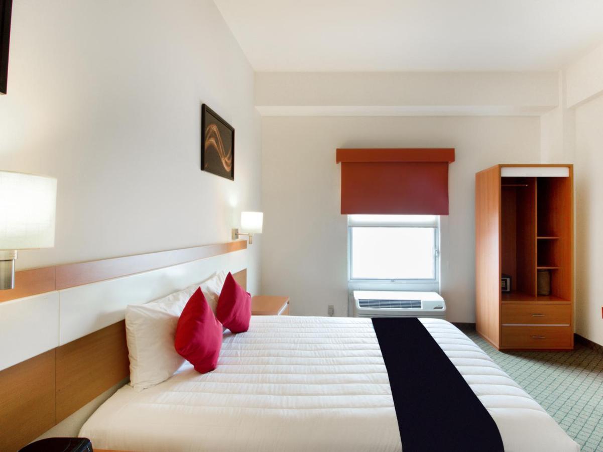 Capital O Hotel Herederos, Пьедрас-Неграс Экстерьер фото